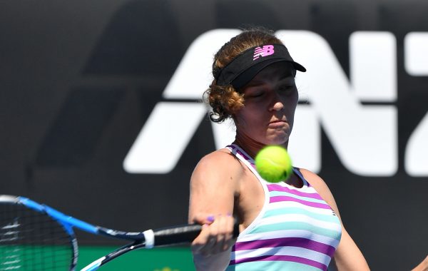 France's Jessica Ponchet hits a return against France's Caroline Garcia on day one of the Australian Open tennis tournament in Melbourne