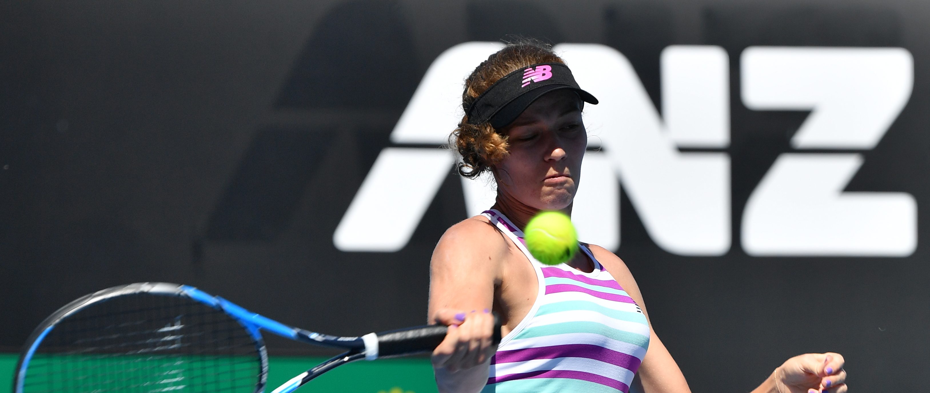 France's Jessica Ponchet hits a return against France's Caroline Garcia on day one of the Australian Open tennis tournament in Melbourne