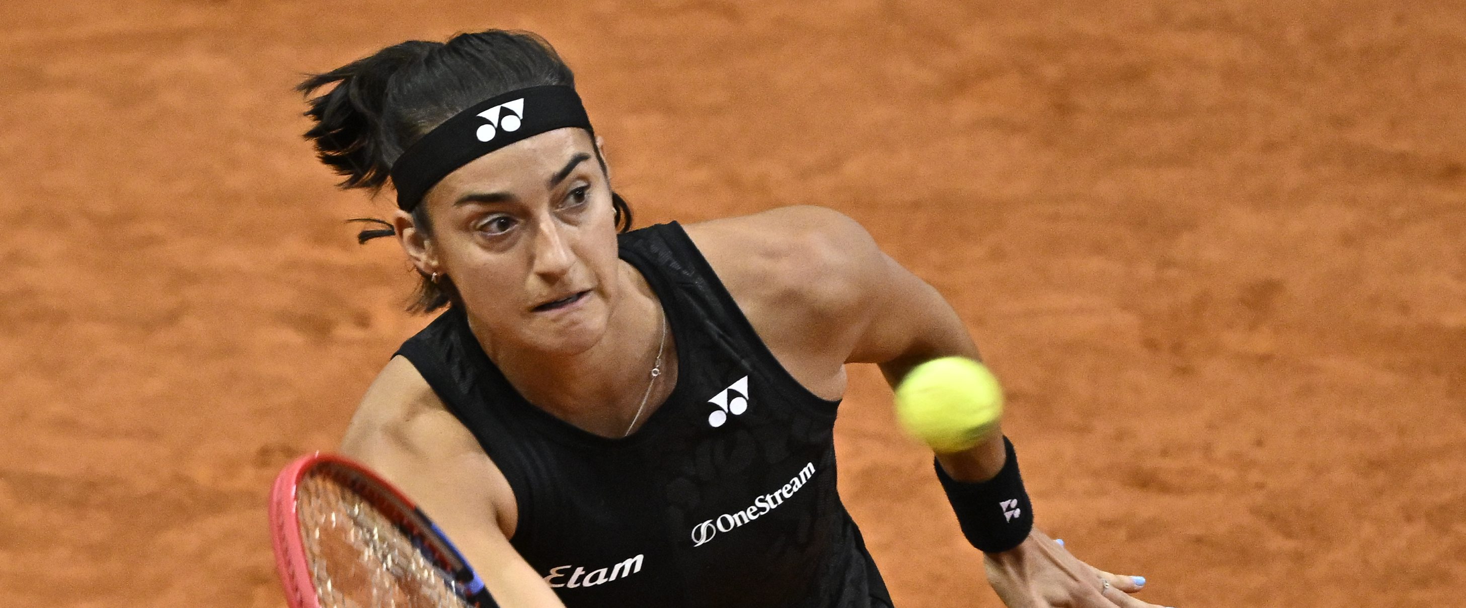 (FILES) France's Caroline Garcia returns the ball to Egypt's Mayar Sherif during their 2023 WTA Tour Madrid Open tennis tournament singles match at the Caja Magica in Madrid on April 29, 2023. - France's number one player France's Caroline Garcia, in the 5th position of the WTA rankings, will take part in the Roland-Garros Open tennis tournament 2023.