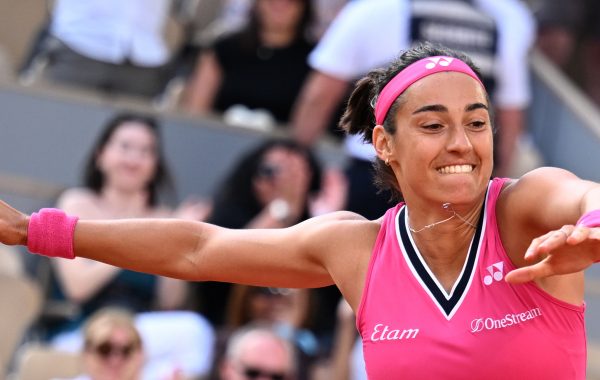 France's Caroline Garcia jumps as she celebrates her victory over China's Wang Xiyu during their women's singles match on day two of the Roland-Garros Open tennis tournament at the Court Philippe-Chatrier in Paris