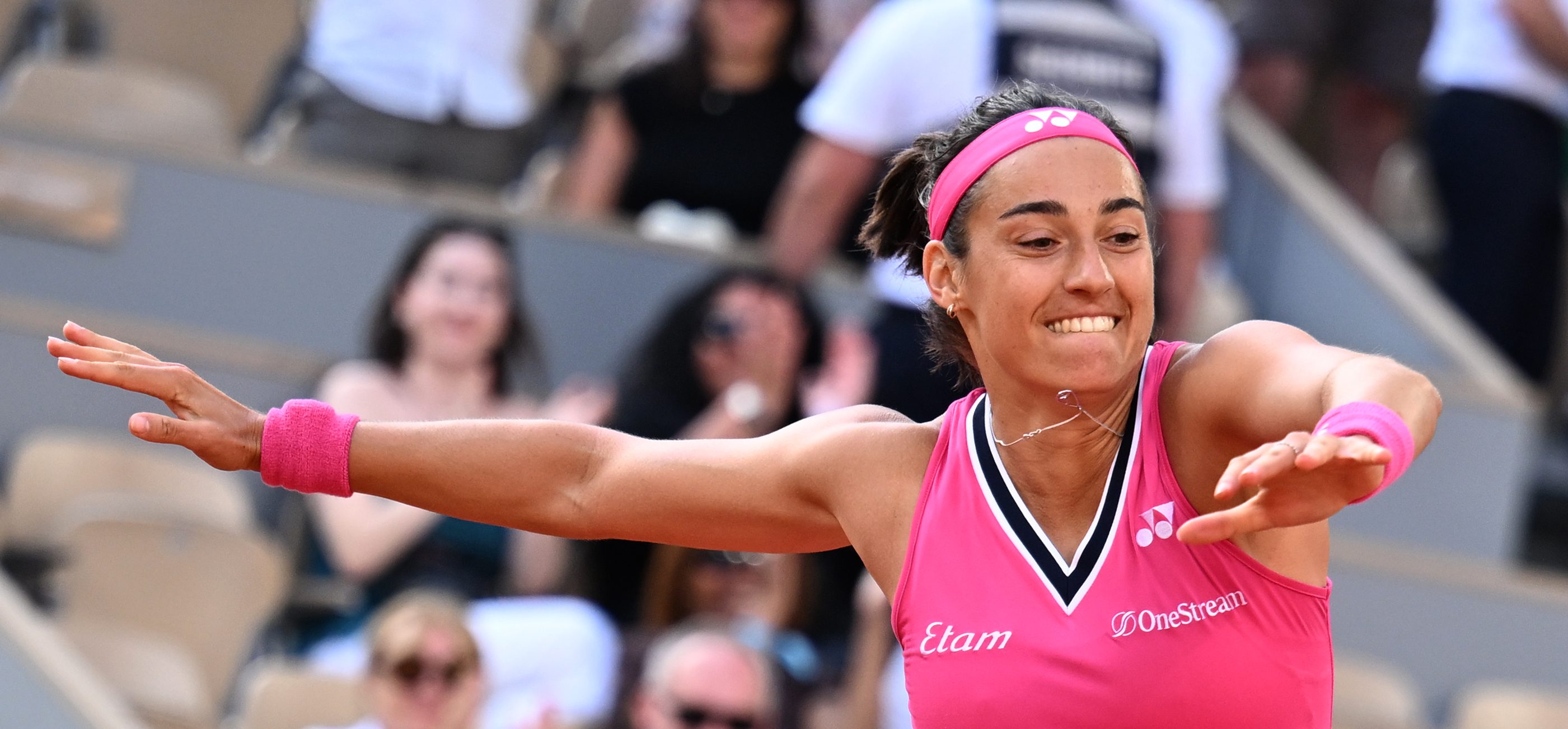 France's Caroline Garcia jumps as she celebrates her victory over China's Wang Xiyu during their women's singles match on day two of the Roland-Garros Open tennis tournament at the Court Philippe-Chatrier in Paris